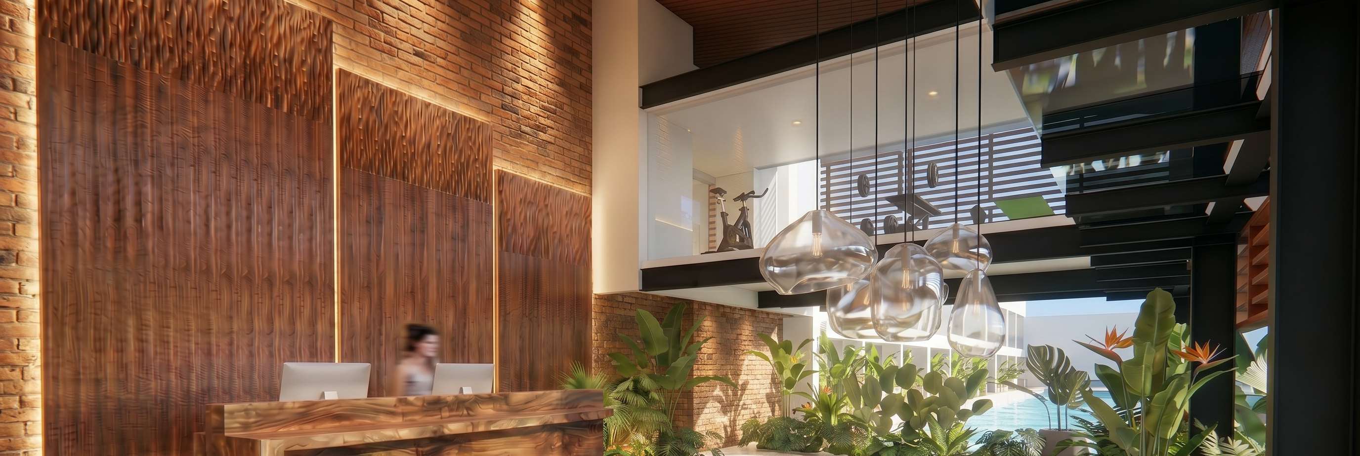 Lobby with mezzanine gym overlooking biophilic lounge.