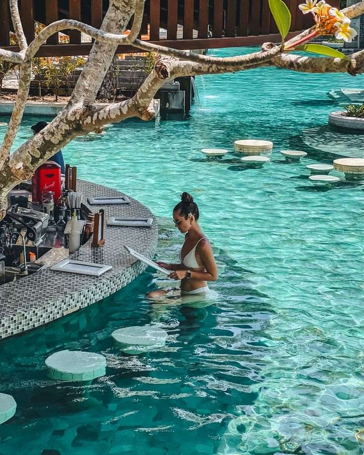 Swim-up bar with turquoise pool water.
