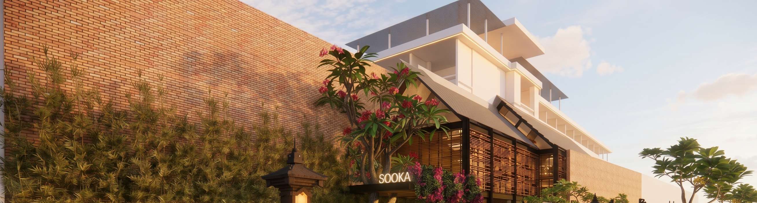 SOOKA entrance with bougainvillea and brick wall at golden hour.